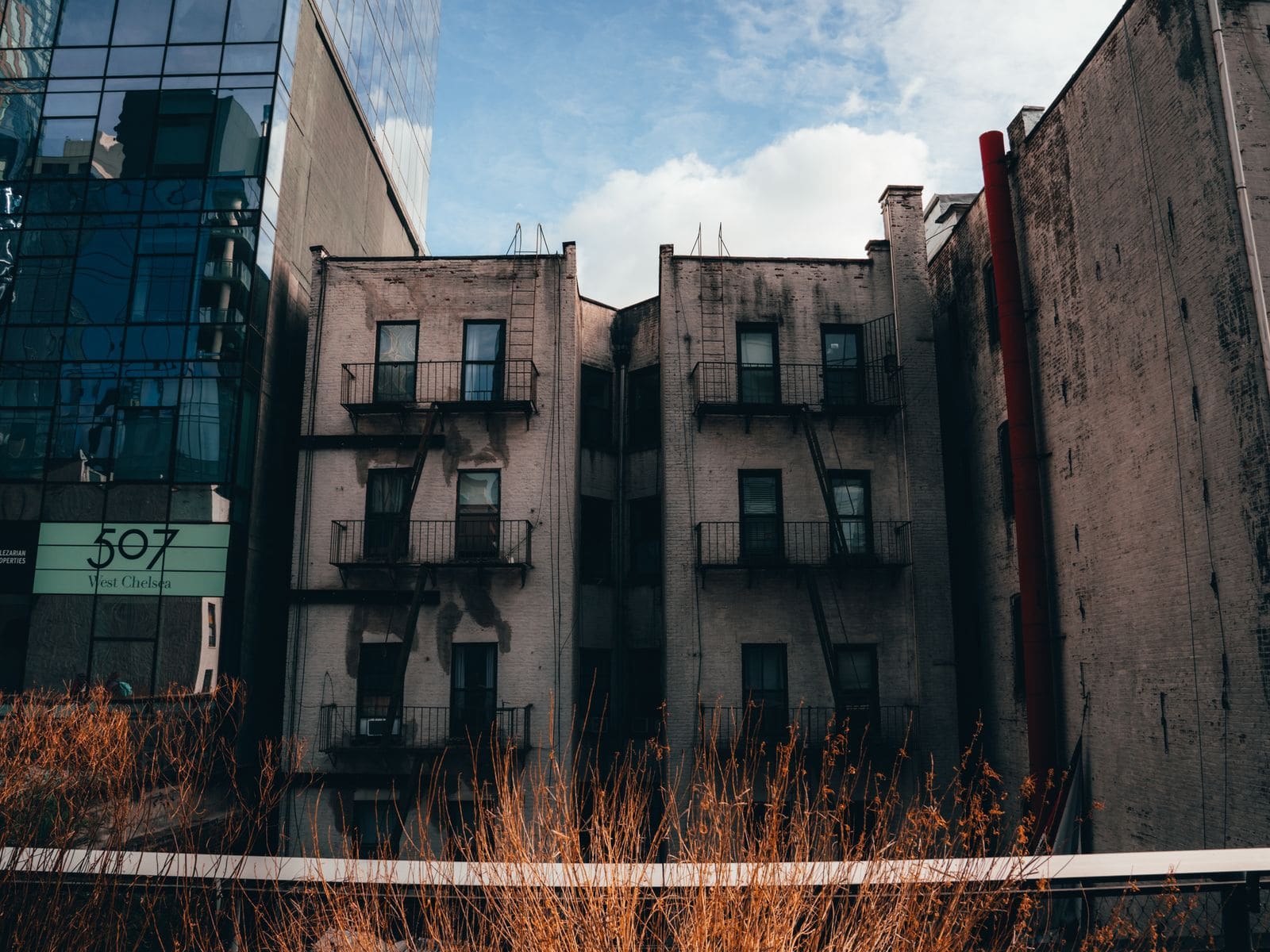 Old brick and new glass buildings side by side in Chelsea